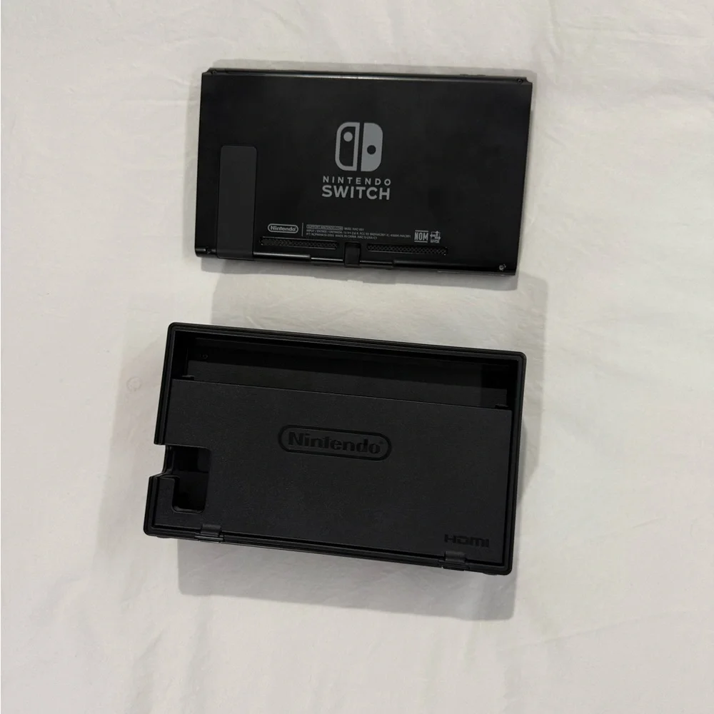 Nintendo Switch with Gray, Purple, and Orange Joy-Con Controllers
